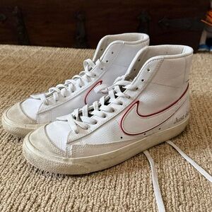 Nike White High-Top Sneakers with Red Swoosh